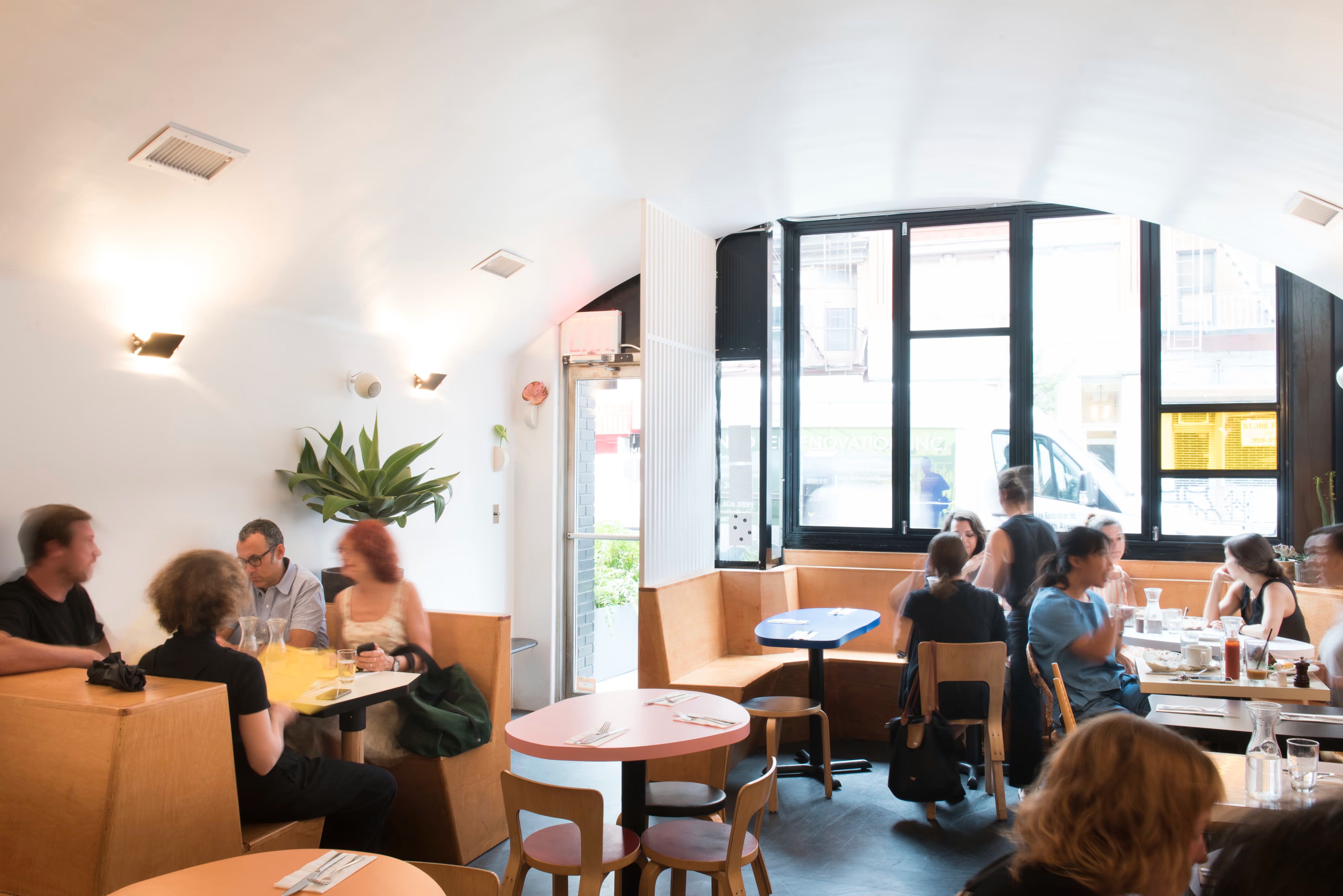 Guests eating at a bright neighborhood restaurant